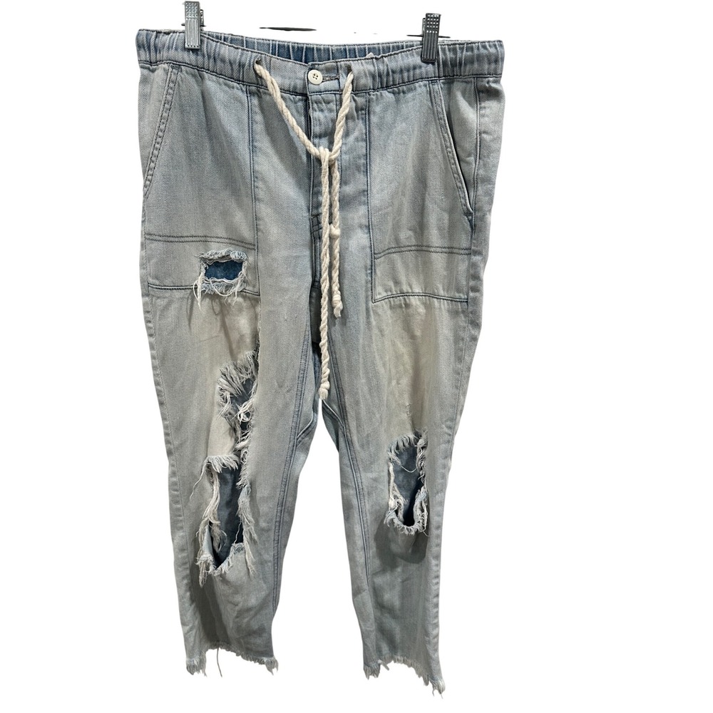 Free People Distressed Denim Jogger Pants Light Wash Ripped Raw Hem Jeans